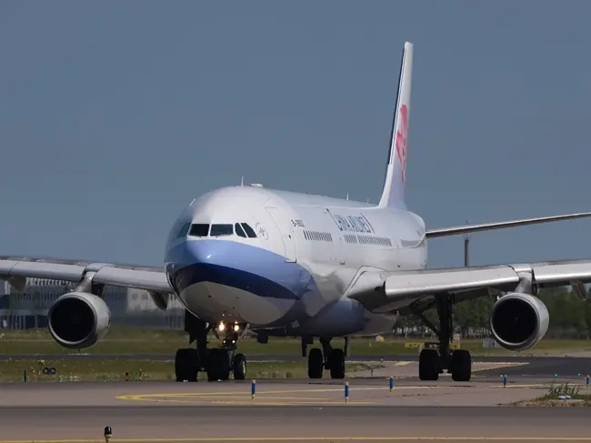 China Airlines plane taxiing on a runway
