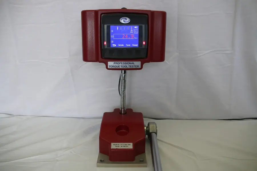 Red AWS torque tester on a white background showing a reading that is too high