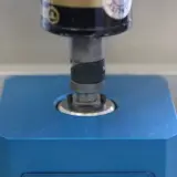 Torque screwdriver applying torque to a blue torque transducer