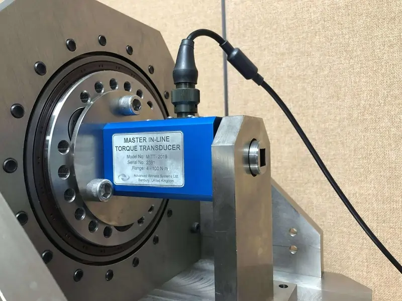 Close up of an AWS Master torque transducer in a calibration machine