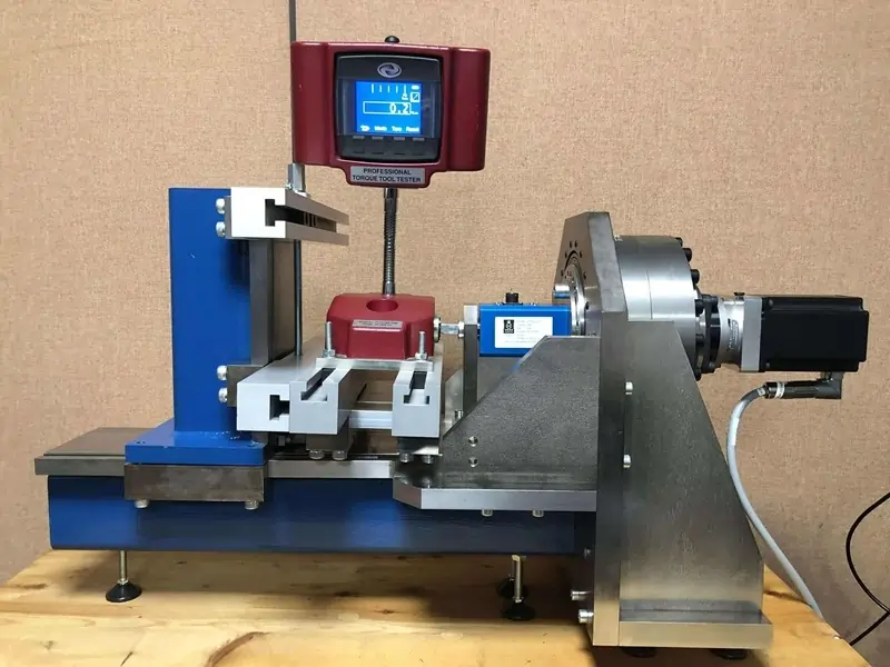 AWS torque tool tester being calibrated on a calibration rig