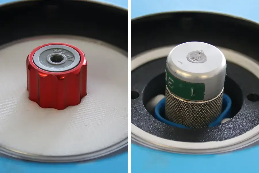 Two torque screwdrivers held in a torque screwdriver calibration tool using handles