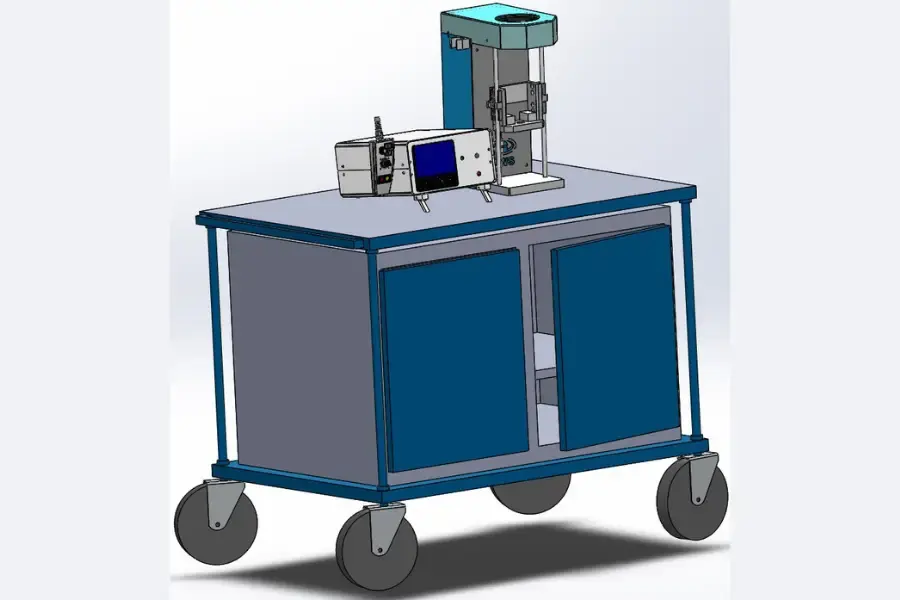 Torque screwdriver tester on top of a wheelable blue metal cabinet
