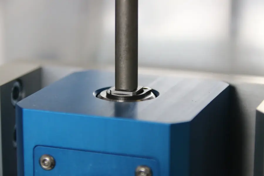 Close up of a torque screwdriver in a torque transducer