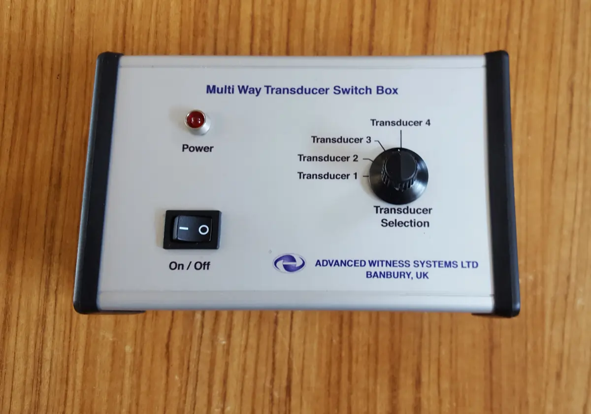 Transducer Switch Box laid on a wooden desk