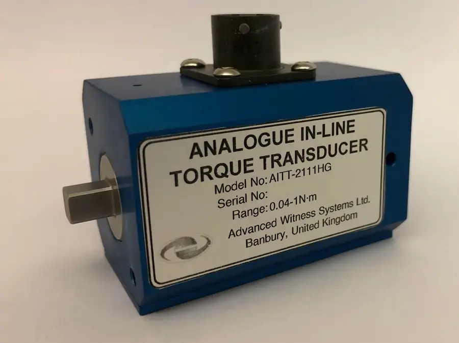 Small blue torque transducer with a silver label on the side